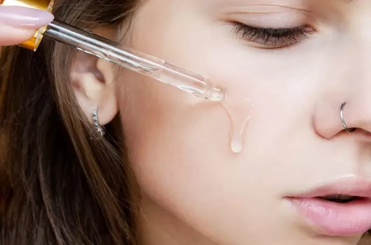 serum application on a woman's face